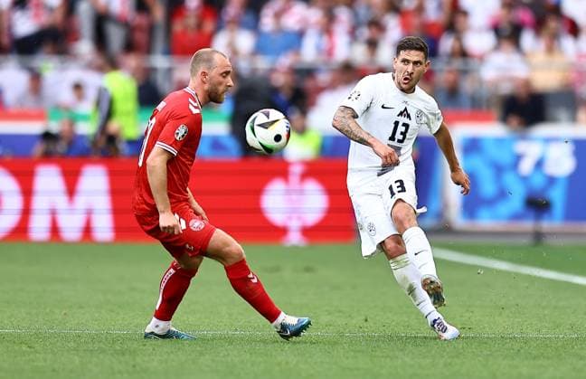Christian Eriksen of Denmark challenges Erik Janza of Slovenia Slovenia v Denmark, UEFA European Championship, EM, Europameisterschaft 2024, Group C, Football, Stuttgart Arena, Stuttgart, Germany, 16 Jun 2024 EDITORIAL USE ONLY No use with unauthorised audio, video, data, fixture lists, club league logos or live services. Online in-match use limited to 120 images, no video emulation. No use in betting, games or single club league player publications. Copyright: xMichaelxZemanek Shutterstockx 14539399fe