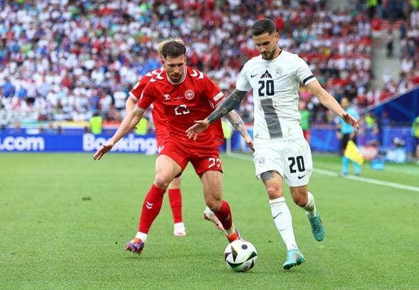 Petar Stojanovic of Slovenia and Pierre-Emile Hojbjerg of Denmark Slovenia v Denmark, UEFA European Championship, EM, Europameisterschaft 2024, Group C, Football, Stuttgart Arena, Stuttgart, Germany, 16 Jun 2024 EDITORIAL USE ONLY No use with unauthorised audio, video, data, fixture lists, club league logos or live services. Online in-match use limited to 120 images, no video emulation. No use in betting, games or single club league player publications. Copyright: xMichaelxZemanek Shutterstockx 14539399gf