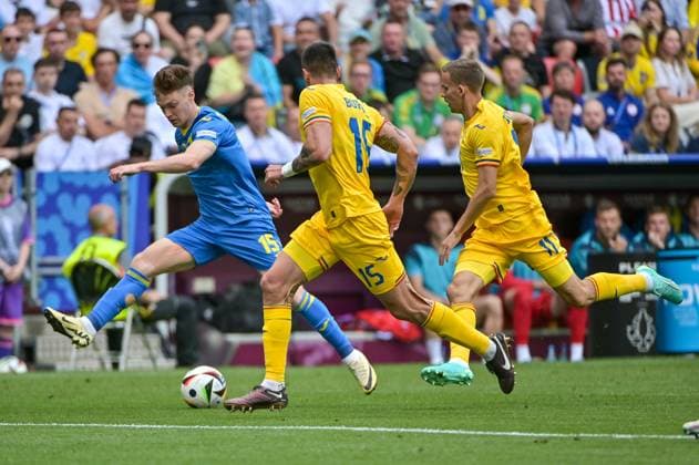 Picture shows from left to right Tsygankov 15, Ukraine , Burca 15, Romania , Bancu 11, Romania , 17 06 2024, Munich, Football, European Championship, Romania Ukraine, EVENT REGULATIONS PROHIBIT ANY USE OF PHOTOGRAPHS AS IMAGE SEQUENCES AND OR QUASI VIDEO xklx