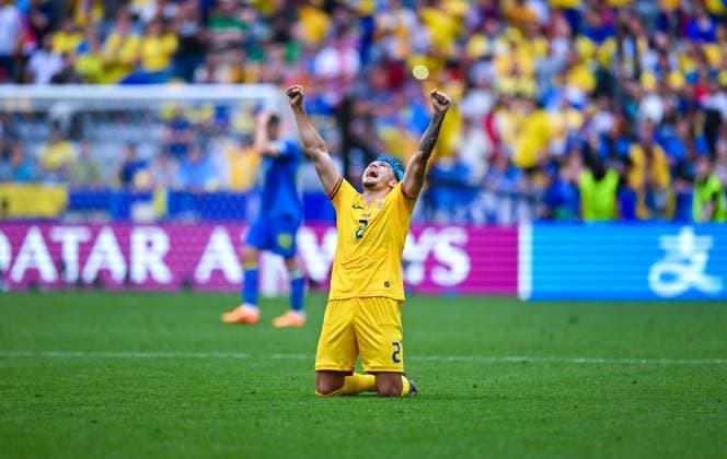 Andrei Ratiu Romania on his knees celebrates the win, UEFA EURO 2024 Group E, Romania vs Ukraine, Munich Football Arena on June 17, 2024 in Munich, Germany Photo by Silas Schueller DeFodi Images Andrei Ratiu Romania knees and celebrates the win, UEFA EURO 2024 Group E, Romania vs Ukraine, Munich Football Arena on June 17, 2024 in Munich, Germany Photo by Silas Schueller DeFodi Images Muenchen Munich Football Arena Bavaria Germany