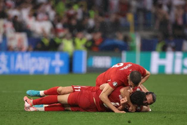 Dortmund, Germany, 18th June 2024. Merih Demiral, Samet Akaydin and Yusuf Yazici of Turkey celebrate the 3-1 victory following the final whistle of the UEFA European Championships match at BVB Stadion, Dortmund. Picture credit should read: Jonathan Moscrop Sportimage EDITORIAL USE ONLY. No use with unauthorised audio, video, data, fixture lists, club league logos or live services. Online in-match use limited to 120 images, no video emulation. No use in betting, games or single club league player publications. SPI-3185-0006