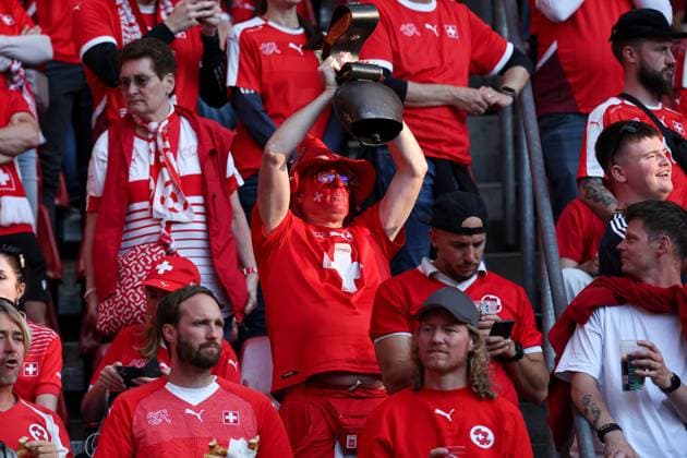 Switzerland fans enjoy the pre-match atmosphere Scotland v Switzerland, UEFA European Championship, EM, Europameisterschaft 2024, Group A, Football, Cologne Stadium, Cologne, Germany, 19 Jun 2024 EDITORIAL USE ONLY No use with unauthorised audio, video, data, fixture lists, club league logos or live services. Online in-match use limited to 120 images, no video emulation. No use in betting, games or single club league player publications. Copyright: xMattxWest Shutterstockx 14543656af