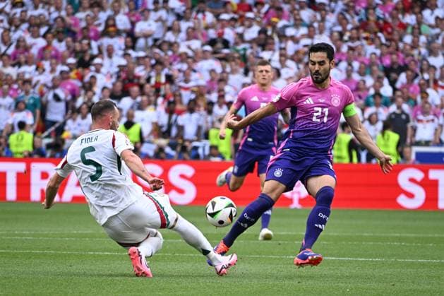 19 06 2024, xsltx, Football EM 2024, Germany Hungary emspor, v l Attila Fiola Hungary, 5 , Ilkay Guendogan Gündogan, Germany, 21 duel, duel, fight, tackle DFL DFB REGULATIONS PROHIBIT ANY USE OF PHOTOGRAPHS as IMAGE SEQUENCES and or QUASI VIDEO Stuttgart