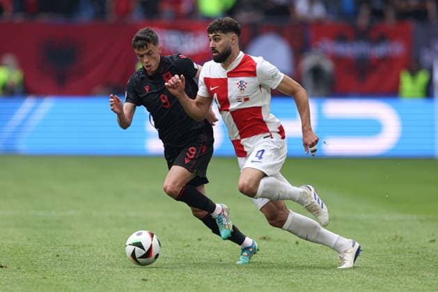 Jasir Asani of Albania and Josko Gvardiol of Croatia Croatia v Albania, UEFA European Championship, EM, Europameisterschaft 2024, Group B, Football, Volksparkstadion, Hamburg, Germany, 19 Jun 2024 EDITORIAL USE ONLY No use with unauthorised audio, video, data, fixture lists, club league logos or live services. Online in-match use limited to 120 images, no video emulation. No use in betting, games or single club league player publications. Copyright: xPaulxCurrie Shutterstockx 14543648gt