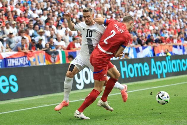 Timi Elsnik of Slovenia and Strahinja Pavlovic of Serbia Slovenia v Serbia, UEFA European Championship, EM, Europameisterschaft 2024, Group C, Football, Munich Football Arena, Munich, Germany, 20 Jun 2024 EDITORIAL USE ONLY No use with unauthorised audio, video, data, fixture lists, club league logos or live services. Online in-match use limited to 120 images, no video emulation. No use in betting, games or single club league player publications. Copyright: xMichaelxZemanek Shutterstockx 14543659bc