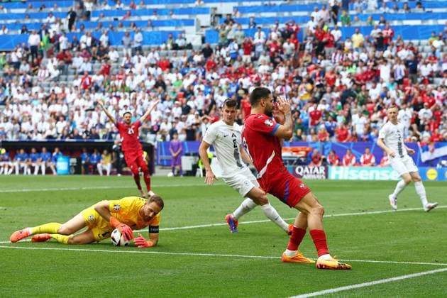 Aleksandar Mitrovic of Serbia has a shot saved Slovenia v Serbia, UEFA European Championship, EM, Europameisterschaft 2024, Group C, Football, Munich Football Arena, Munich, Germany, 20 Jun 2024 EDITORIAL USE ONLY No use with unauthorised audio, video, data, fixture lists, club league logos or live services. Online in-match use limited to 120 images, no video emulation. No use in betting, games or single club league player publications. Copyright: xMichaelxZemanek Shutterstockx 14543659bi