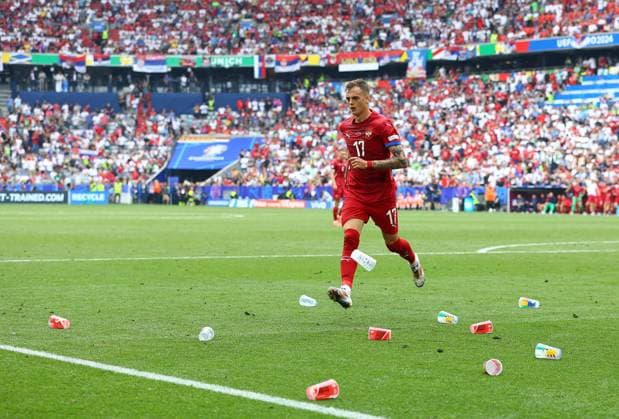 Ivan Ilic of Sebia kicks the empty plastic beer cup away Slovenia v Serbia, UEFA European Championship, EM, Europameisterschaft 2024, Group C, Football, Munich Football Arena, Munich, Germany, 20 Jun 2024 EDITORIAL USE ONLY No use with unauthorised audio, video, data, fixture lists, club league logos or live services. Online in-match use limited to 120 images, no video emulation. No use in betting, games or single club league player publications. Copyright: xMichaelxZemanek Shutterstockx 14543659cr