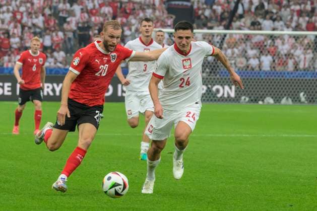 GER, Berlin, Football, Poland vs Austria, Group D, Group stage, UEFA EURO 2024, MD3, SP, Olympia Stadion Berlin, v l Konrad Laimer Austria , Bartosz Slisz Poland , duel, action, fight, fights for the ball, 21 06 2024, Copyright: HMBxMedia UwexKoch