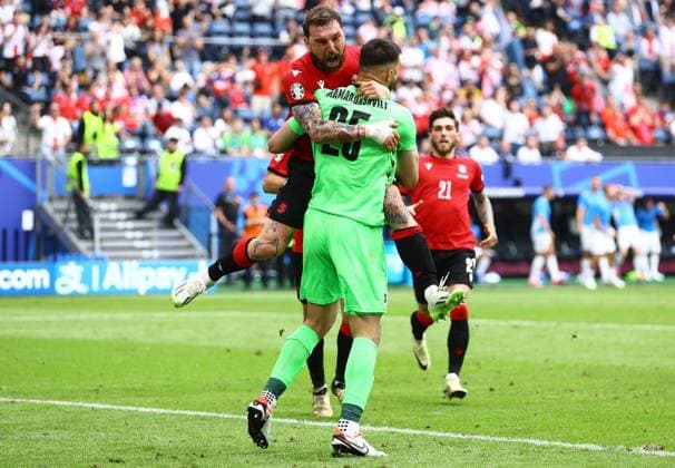 Guram Kashia of Georgia celebrates with Giorgi Mamardashvili of Georgia after making a save shortly before half time Georgia v Czechia, UEFA European Championship, EM, Europameisterschaft 2024, Group F, Football, Volksparkstadion, Hamburg, Germany, 22 Jun 2024 EDITORIAL USE ONLY No use with unauthorised audio, video, data, fixture lists, club league logos or live services. Online in-match use limited to 120 images, no video emulation. No use in betting, games or single club league player publications. Copyright: xKieranxMcManus Shutterstockx 14548025aj