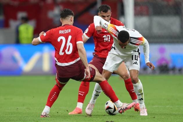 Fabian Rieder Switzerland , Granit Xhaka Switzerland and Jamal Musiala Germany battle for the ball, UEFA EURO 2024 Group A, Switzerland vs Germany, Arena Frankfurt on June 23, 2024 in Frankfurt am Main, Germany Photo by Oliver Kaelke DeFodi Images Fabian Rieder Switzerland , Granit Xhaka Switzerland and Jamal Musiala Germany battle for the ball, UEFA EURO 2024 Group A, Switzerland vs Germany, Arena Frankfurt on June 23, 2024 in Frankfurt am Main, Germany Photo by Oliver Kaelke DeFodi Images Defodi 678 2024 06 23 OK SUIGER 1002 Defodi-678