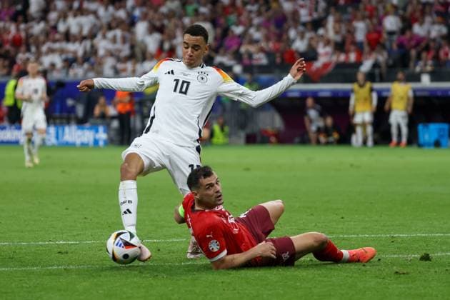 Jamal Musiala GER, 10 on the ball, Granit Xhaka Switzerland, 10 on the ground , Football, UEFA , European Championship, Group A 2024, Switzerland vs Germany, 23 06 2024, Frankfurt Arena, Frankfurt, Germany Frankfurt Frankfurt Arena Hessen Germany Copyright: xGrantxHubbsx