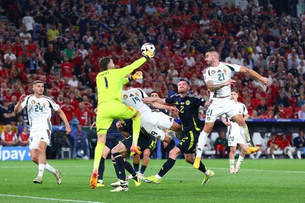 Angus Gunn of Scotland comes for the ball and Barnabas Varga of Hungary is injured in the process Scotland v Hungary, UEFA European Championship, EM, Europameisterschaft 2024, Group A, Football, Stuttgart Arena, Stuttgart, Germany, 23 Jun 2024 EDITORIAL USE ONLY No use with unauthorised audio, video, data, fixture lists, club league logos or live services. Online in-match use limited to 120 images, no video emulation. No use in betting, games or single club league player publications. Copyright: xMichaelxZemanek Shutterstockx 14548075aw