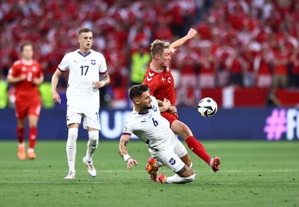 Nemanja Gudelj of Serbia is fouled by Rasmus Hojlund of Denmark Denmark v Serbia, UEFA European Championship, EM, Europameisterschaft 2024, Group C, Football, Munich Football Arena, Munich, Germany, 25 Jun 2024 EDITORIAL USE ONLY No use with unauthorised audio, video, data, fixture lists, club league logos or live services. Online in-match use limited to 120 images, no video emulation. No use in betting, games or single club league player publications. Copyright: xMichaelxZemanek Shutterstockx 14555536at
