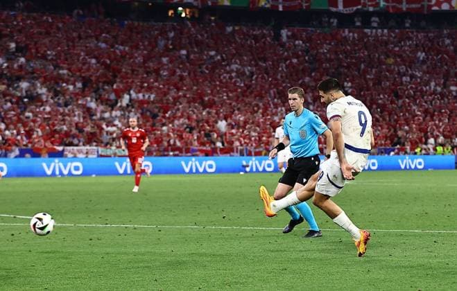 Aleksandar Mitrovic of Serbia has a shot Denmark v Serbia, UEFA European Championship, EM, Europameisterschaft 2024, Group C, Football, Munich Football Arena, Munich, Germany, 25 Jun 2024 EDITORIAL USE ONLY No use with unauthorised audio, video, data, fixture lists, club league logos or live services. Online in-match use limited to 120 images, no video emulation. No use in betting, games or single club league player publications. Copyright: xMichaelxZemanek Shutterstockx 14555536cm
