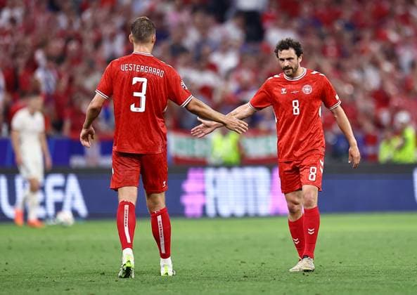 Jannik Vestergaard of Denmark and Thomas Delaney of Denmark at full time Denmark v Serbia, UEFA European Championship, EM, Europameisterschaft 2024, Group C, Football, Munich Football Arena, Munich, Germany, 25 Jun 2024 EDITORIAL USE ONLY No use with unauthorised audio, video, data, fixture lists, club league logos or live services. Online in-match use limited to 120 images, no video emulation. No use in betting, games or single club league player publications. Copyright: xMichaelxZemanek Shutterstockx 14555536cy