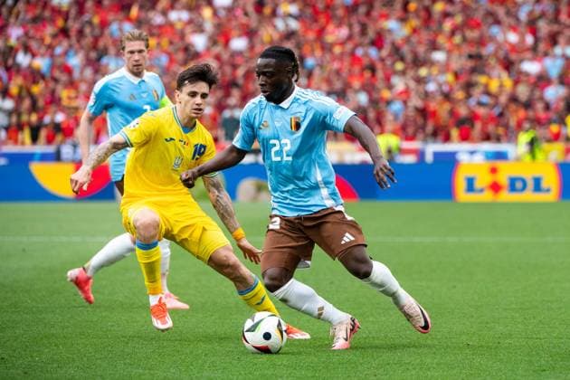 Jeremy Doku Belgium, 22 in duel with Mykola Shaparenko Ukraine, 19 , GER, Ukraine UKR vs Belgium BEL , European Football Championship, UEFA EURO 2024, Group E, Matchday 3, 26 06 2024 GER, Ukraine UKR vs Belgium BEL , European Football Championship, UEFA EURO 2024, Group E, Matchday 3, 26 06 2024 Stuttgart Copyright: xEibner-Pressefoto Memmlerx EP_MMR