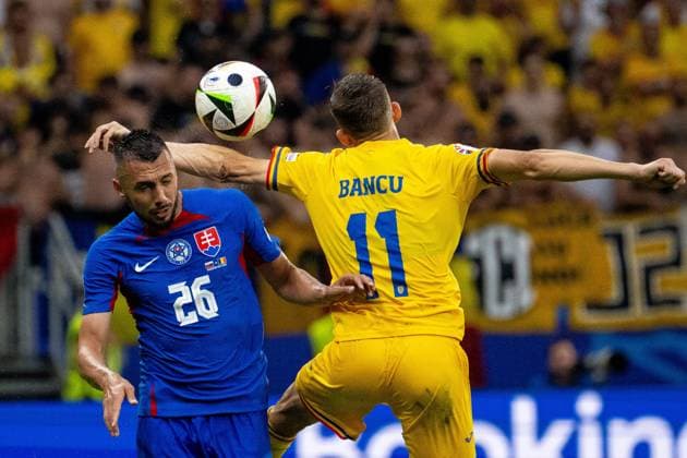 GER, EURO 2024, Group E, Slovakia SVK vs Romania ROU 24 06 2024, Frankfurt Arena, Frankfurt, GER, EURO 2024, Group E, Slovakia SVK vs Romania ROU In the picture JIvan Schranz Slovakia SVK, 26 header header duel dynamics, action, action, game scene Nicusor Bancu Romania ROU, 11 in duel, duel, dynamics, action, action, game scene nordphotoxGmbHxx xDenkinger nph00015