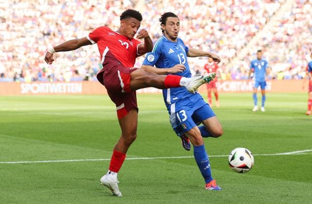 Dan Ndoye of Switzerland shoots at goal as Matteo Darmian of Italy covers Switzerland v Italy, UEFA European Championship, EM, Europameisterschaft 2024, Round of 16, Football, Olympiastadion, Berlin, Germany - 29 Jun 2024 EDITORIAL USE ONLY No use with unauthorised audio, video, data, fixture lists, club league logos or live services. Online in-match use limited to 120 images, no video emulation. No use in betting, games or single club league player publications. Copyright: xPaulxCurrie Shutterstockx 14562043an