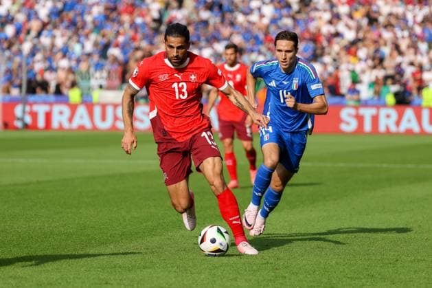 Ricardo Rodriguez Switzerland, 13 in duel with Federico Chiesa Italy, 14 , Football, UEFA , European Championship, Round of 16 2024, Switzerland vs Italy, 29 06 2024, Olympiastadion Berlin, Berlin, Germany Berlin Olympiastadion Berlin Berlin Germany Copyright: xGrantxHubbsx