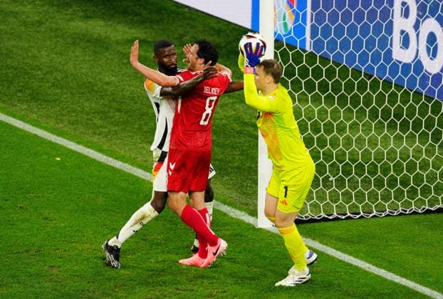 Manuel Neuer of Germany claims the ball as Antonio Rudiger blocks Thomas Delaney of Denmark Germany v Denmark, UEFA European Championship, EM, Europameisterschaft 2024, Round of 16, Football, BVB Stadion, Dortmund, Germany - 29 Jun 2024 EDITORIAL USE ONLY No use with unauthorised audio, video, data, fixture lists, club league logos or live services. Online in-match use limited to 120 images, no video emulation. No use in betting, games or single club league player publications. Copyright: xDavexShopland Shutterstockx 14562067j