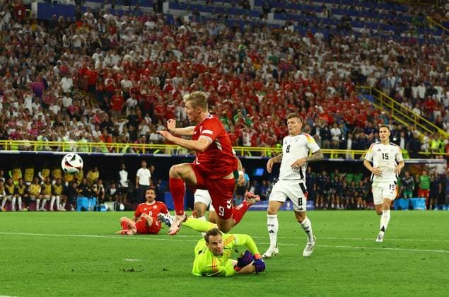 Manuel Neuer of Germany saves at the feet of Rasmus Hojlund of Denmark Germany v Denmark, UEFA European Championship, EM, Europameisterschaft 2024, Round of 16, Football, BVB Stadion, Dortmund, Germany - 29 Jun 2024 EDITORIAL USE ONLY No use with unauthorised audio, video, data, fixture lists, club league logos or live services. Online in-match use limited to 120 images, no video emulation. No use in betting, games or single club league player publications. Copyright: xKieranxMcManus Shutterstockx 14562066bj