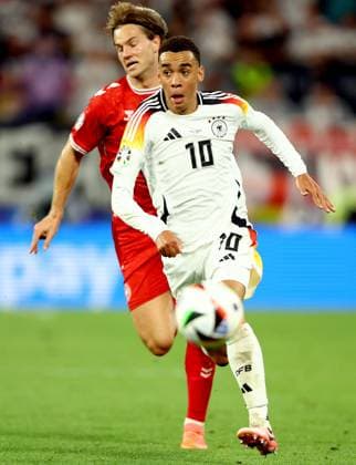 Jamal Musiala of Germany and Joachim Andersen of Denmark Germany v Denmark, UEFA European Championship, EM, Europameisterschaft 2024, Round of 16, Football, BVB Stadion, Dortmund, Germany - 29 Jun 2024 EDITORIAL USE ONLY No use with unauthorised audio, video, data, fixture lists, club league logos or live services. Online in-match use limited to 120 images, no video emulation. No use in betting, games or single club league player publications. Copyright: xKieranxMcManus Shutterstockx 14562066cj