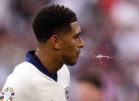 EURO 2024, England - Slowakei Jude Bellingham of England spitting England v Slovakia, UEFA European Championship, EM, Europameisterschaft 2024, Round of 16, Football, Arena AufSchalke, Gelsenkirchen, Germany - 30 Jun 2024 EDITORIAL USE ONLY No use with unauthorised audio, video, data, fixture lists, club league logos or live services. Online in-match use limited to 120 images, no video emulation. No use in betting, games or single club league player publications. Copyright: xPaulxCurrie Shutterstockx 14562219dx