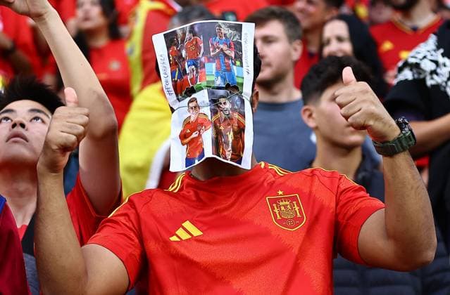 A Spanish fan wears a mask of their teams layers on it Spain v Georgia, UEFA European Championship, EM, Europameisterschaft 2024, Round of 16, Football, Cologne Stadium, Cologne, Germany - 30 Jun 2024 EDITORIAL USE ONLY No use with unauthorised audio, video, data, fixture lists, club league logos or live services. Online in-match use limited to 120 images, no video emulation. No use in betting, games or single club league player publications. Copyright: xMichaelxZemanek Shutterstockx 14562306l