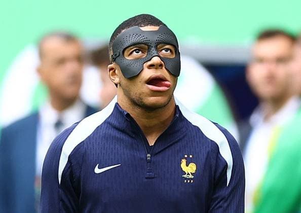 Kylian Mbappe of France puts on his face mask to protect his broken nose during warm up France v Belgium, UEFA European Championship, EM, Europameisterschaft 2024, Round of 16, Football, Dusseldorf Arena, Dusseldorf, Germany - 01 Jul 2024 EDITORIAL USE ONLY No use with unauthorised audio, video, data, fixture lists, club league logos or live services. Online in-match use limited to 120 images, no video emulation. No use in betting, games or single club league player publications. Copyright: xKieranxMcManus Shutterstockx 14566634u