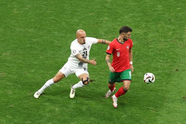 Bruno Fernandes of Portugal and Vanja Drkusic of Slovenia Portugal v Slovenia, UEFA European Championship, EM, Europameisterschaft 2024, Round of 16, Football, Frankfurt Arena, Frankfurt, Germany - 01 Jul 2024 EDITORIAL USE ONLY No use with unauthorised audio, video, data, fixture lists, club league logos or live services. Online in-match use limited to 120 images, no video emulation. No use in betting, games or single club league player publications. Copyright: xPaulxCurrie Shutterstockx 14566636aa