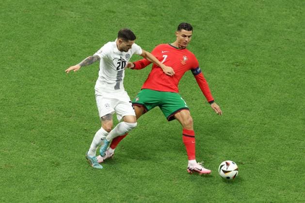 Cristiano Ronaldo of Portugal and Petar Stojanovic of Slovenia Portugal v Slovenia, UEFA European Championship, EM, Europameisterschaft 2024, Round of 16, Football, Frankfurt Arena, Frankfurt, Germany - 01 Jul 2024 EDITORIAL USE ONLY No use with unauthorised audio, video, data, fixture lists, club league logos or live services. Online in-match use limited to 120 images, no video emulation. No use in betting, games or single club league player publications. Copyright: xPaulxCurrie Shutterstockx 14566636ad