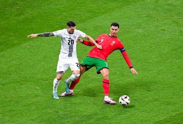 Cristiano Ronaldo Portugal and Petar Stojanovic Slovenia in a duel, UEFA EURO 2024 Round of 16, Portugal vs Slovenia, Arena Frankfurt on July 01, 2024 in Frankfurt am Main, Germany Photo by Silas Schueller DeFodi Images Cristiano Ronaldo Portugal and Petar Stojanovic Slovenia battle for the ball, UEFA EURO 2024 Round of 16, Portugal vs Slovenia, Arena Frankfurt on July 1, 2024 in Frankfurt am Main, Germany Photo by Silas Schueller DeFodi Images Defodi 738 738 PORSVN 20240701 171 Defodi-738
