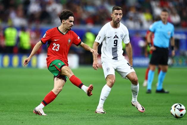 Vitinha of Portugal and Andraz Sporar of Slovenia Portugal v Slovenia, UEFA European Championship, EM, Europameisterschaft 2024, Round of 16, Football, Frankfurt Arena, Frankfurt, Germany - 01 Jul 2024 EDITORIAL USE ONLY No use with unauthorised audio, video, data, fixture lists, club league logos or live services. Online in-match use limited to 120 images, no video emulation. No use in betting, games or single club league player publications. Copyright: xMichaelxZemanek Shutterstockx 14566640af