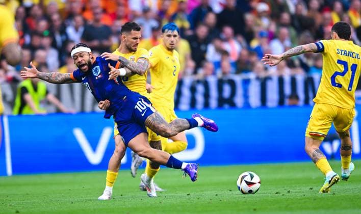 Memphis Depay Netherlands and Marius Marin Romania in a duel, UEFA EURO 2024 Round of 16, Romania vs the Netherlands, Munich Football Arena on July 02, 2024 in Munich, Germany Photo by Silas Schueller DeFodi Images Memphis Depay Netherlands and Marius Marin Romania battle for the ball, UEFA EURO 2024 Round of 16, Romania vs the Netherlands, Munich Football Arena on July 2, 2024 in Munich, Germany Photo by Silas Schueller DeFodi Images Defodi 738 738 ROUNED 20240702 134 Defodi-738