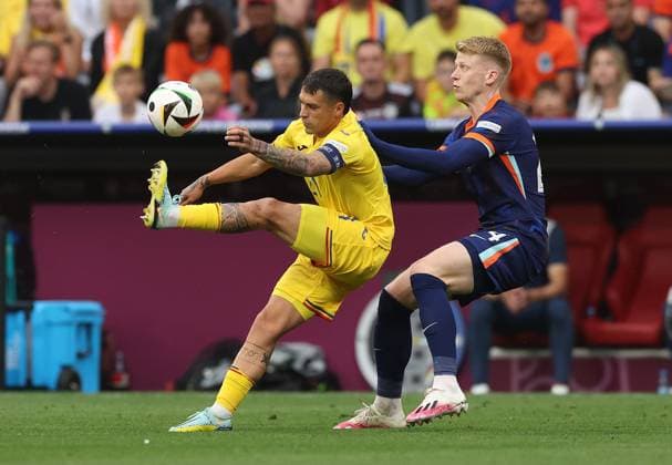 Jerdy Schouten of Netherlands challenges Nicolae Stanciu of Romania Romania v Netherlands, UEFA European Championship, EM, Europameisterschaft 2024, Round of 16, Football, Munich Football Arena, Munich, Germany - 02 Jul 2024 EDITORIAL USE ONLY No use with unauthorised audio, video, data, fixture lists, club league logos or live services. Online in-match use limited to 120 images, no video emulation. No use in betting, games or single club league player publications. Copyright: xPaulxCurrie Shutterstockx 14566647ar