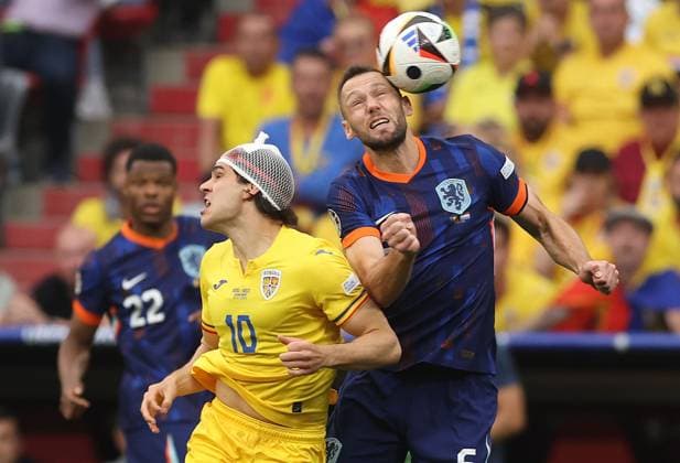 Ianis Hagi of Romania is challenged by Stefan de Vrij of Netherlands Romania v Netherlands, UEFA European Championship, EM, Europameisterschaft 2024, Round of 16, Football, Munich Football Arena, Munich, Germany - 02 Jul 2024 EDITORIAL USE ONLY No use with unauthorised audio, video, data, fixture lists, club league logos or live services. Online in-match use limited to 120 images, no video emulation. No use in betting, games or single club league player publications. Copyright: xPaulxCurrie Shutterstockx 14566647ap