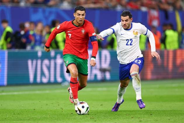 Cristiano Ronaldo of Portugal and Thà o Hernandez of France Portugal v France, UEFA European Championship, EM, Europameisterschaft 2024, Quarter Final, Football, Volksparkstadion, Hamburg, Germany, 05 Jul 2024 EDITORIAL USE ONLY No use with unauthorised audio, video, data, fixture lists, club league logos or live services. Online in-match use limited to 120 images, no video emulation. No use in betting, games or single club league player publications. Copyright: xKieranxMcManus Shutterstockx 14571382aq