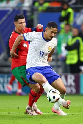 Cristiano Ronaldo of Portugal and William Saliba of France Portugal v France, UEFA European Championship, EM, Europameisterschaft 2024, Quarter Final, Football, Volksparkstadion, Hamburg, Germany, 05 Jul 2024 EDITORIAL USE ONLY No use with unauthorised audio, video, data, fixture lists, club league logos or live services. Online in-match use limited to 120 images, no video emulation. No use in betting, games or single club league player publications. Copyright: xKieranxMcManus Shutterstockx 14571382at