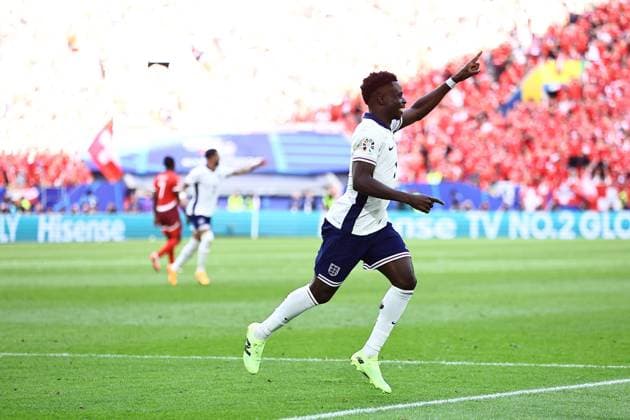 Bukayo Saka of England celebrates their goal to make it 1-1 England v Switzerland, UEFA European Championship, EM, Europameisterschaft 2024, Quarter Final, Football, Dusseldorf Arena, Dusseldorf, Germany, 06 Jul 2024 EDITORIAL USE ONLY No use with unauthorised audio, video, data, fixture lists, club league logos or live services. Online in-match use limited to 120 images, no video emulation. No use in betting, games or single club league player publications. Copyright: xMichaelxZemanek Shutterstockx 14571385bu
