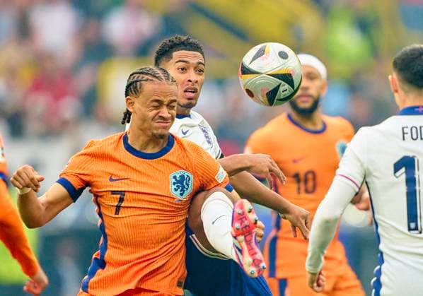Xavi Simons, NL 7 compete for the ball, tackling, duel, header, zweikampf, action, fight against Jude Bellingham, ENG 10 in the semi final match NETHERLANDS - ENGLAND of the UEFA European Championships 2024 on Jul 10, 2024 in Dortmund, Germany.