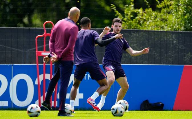 Ezri Konsa and Declan Rice of England England Training, UEFA European Championship, EM, Europameisterschaft 2024, Final, Football, Spa & Golf Resort Weimarer Land, Blankenhain, Germany, 13 Jul 2024 EDITORIAL USE ONLY No use with unauthorised audio, video, data, fixture lists, club league logos or live services. Online in-match use limited to 120 images, no video emulation. No use in betting, games or single club league player publications. Copyright: xDavexShopland Shutterstockx 14583292bp