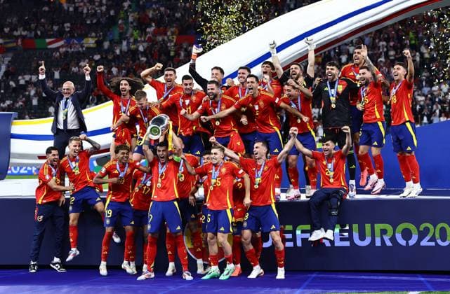 Ãlvaro Morata of Spain lifts the 2024 UEFA European Football Championship trophy as the team celebrates Spain v England, UEFA European Championship, EM, Europameisterschaft 2024, Final, Football, Olympiastadion, Berlin, Germany, 14 Jul 2024 EDITORIAL USE ONLY No use with unauthorised audio, video, data, fixture lists, club league logos or live services. Online in-match use limited to 120 images, no video emulation. No use in betting, games or single club league player publications. Copyright: xMichaelxZemanek Shutterstockx 14583343ex