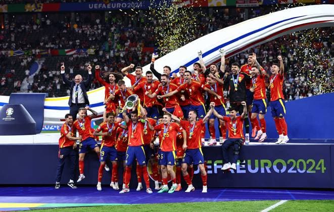Ãlvaro Morata of Spain lifts the 2024 UEFA European Football Championship trophy as the team celebrates Spain v England, UEFA European Championship, EM, Europameisterschaft 2024, Final, Football, Olympiastadion, Berlin, Germany, 14 Jul 2024 EDITORIAL USE ONLY No use with unauthorised audio, video, data, fixture lists, club league logos or live services. Online in-match use limited to 120 images, no video emulation. No use in betting, games or single club league player publications. Copyright: xMichaelxZemanek Shutterstockx 14583343ew