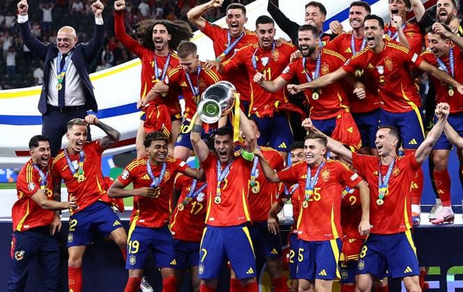 Ãlvaro Morata of Spain lifts the 2024 UEFA European Football Championship trophy as the team celebrates Spain v England, UEFA European Championship, EM, Europameisterschaft 2024, Final, Football, Olympiastadion, Berlin, Germany, 14 Jul 2024 EDITORIAL USE ONLY No use with unauthorised audio, video, data, fixture lists, club league logos or live services. Online in-match use limited to 120 images, no video emulation. No use in betting, games or single club league player publications. Copyright: xMichaelxZemanek Shutterstockx 14583343ey