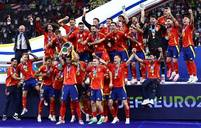 Ãlvaro Morata of Spain lifts the 2024 UEFA European Football Championship trophy as the team celebrates Spain v England, UEFA European Championship, EM, Europameisterschaft 2024, Final, Football, Olympiastadion, Berlin, Germany, 14 Jul 2024 EDITORIAL USE ONLY No use with unauthorised audio, video, data, fixture lists, club league logos or live services. Online in-match use limited to 120 images, no video emulation. No use in betting, games or single club league player publications. Copyright: xMichaelxZemanek Shutterstockx 14583343ez