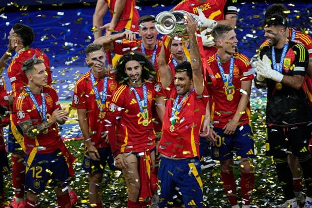 Rodri of Spain lifts the 2024 UEFA European Football Championship trophy Spain v England, UEFA European Championship, EM, Europameisterschaft 2024, Final, Football, Olympiastadion, Berlin, Germany, 14 Jul 2024 EDITORIAL USE ONLY No use with unauthorised audio, video, data, fixture lists, club league logos or live services. Online in-match use limited to 120 images, no video emulation. No use in betting, games or single club league player publications. Copyright: xDavexShopland Shutterstockx 14583342fn