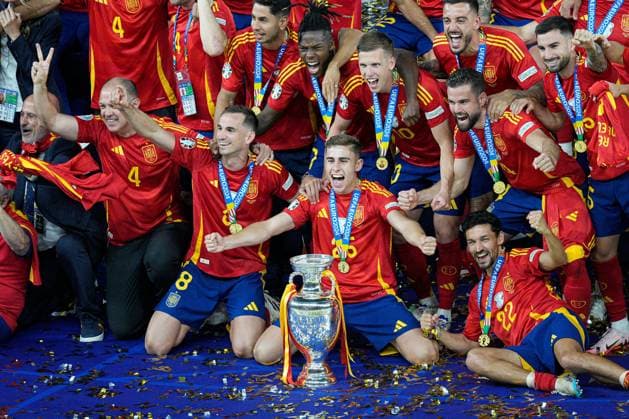 Spain players celebrate winning the 2024 UEFA European Football Championship with the trophy Spain v England, UEFA European Championship, EM, Europameisterschaft 2024, Final, Football, Olympiastadion, Berlin, Germany, 14 Jul 2024 EDITORIAL USE ONLY No use with unauthorised audio, video, data, fixture lists, club league logos or live services. Online in-match use limited to 120 images, no video emulation. No use in betting, games or single club league player publications. Copyright: xDavexShopland Shutterstockx 14583342fm