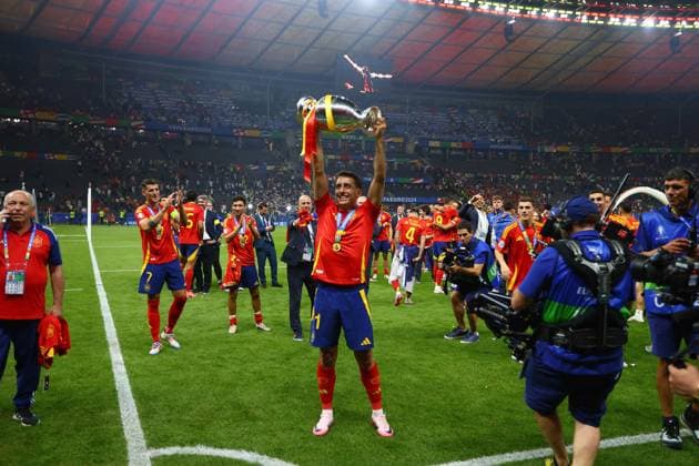 Mikel Oyarzabal of Spain lifts the 2024 UEFA European Football Championship trophy as the team celebrates Spain v England, UEFA European Championship, EM, Europameisterschaft 2024, Final, Football, Olympiastadion, Berlin, Germany, 14 Jul 2024 EDITORIAL USE ONLY No use with unauthorised audio, video, data, fixture lists, club league logos or live services. Online in-match use limited to 120 images, no video emulation. No use in betting, games or single club league player publications. Copyright: xMichaelxZemanek Shutterstockx 14583343fc