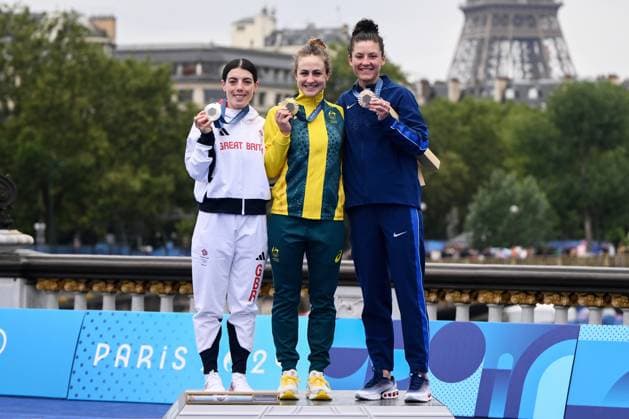 OLY24 CYCLING ROAD, (L-R) Silver medallist British cyclist Anna Henderson, gold medallist Australian cyclist Grace Brown and bronze medallist American cyclist Chloà Dygert celebrate on the podium after the Women s Individual Time Trial at Pont Alexandre III as part of the 2024 Paris Olympic Games, Olympische Spiele, Olympia, OS in Paris, France, Saturday, July 27, 2024. ( NO ARCHIVING, EDITORIAL USE ONLY, NO USE IN BOOKS WITHOUT CONSENT PARIS FRANCE Copyright: xJOELxCARRETTx 20240728173765058955