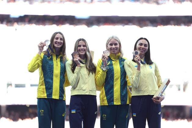 (240805) -- PARIS, Aug. 5, 2024 -- Gold medalist Yaroslava Mahuchikh (2nd L) of Ukraine, silver medalist Nicola Olyslagers (1st L) of Australia, bronze medalists Eleanor Patterson(2nd R) of Australia and Iryna Gerashchenko of Ukraine react during the victory ceremony of the women s high jump of athletics at the Paris 2024 Olympic Games, Olympische Spiele, Olympia, OS in Paris, France, Aug. 5, 2024. ) (PARIS2024) FRANCE-PARIS-OLY-ATHLETICS-HIGH JUMP-WOMEN LixYing